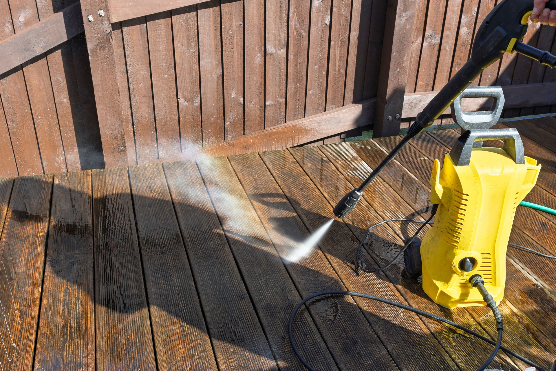 Spring Cleaning Domestic Garden Wooden Decking with Water Jet High Pressure Washer